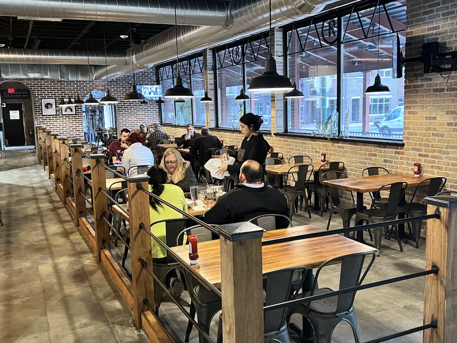 Dining room with people and server