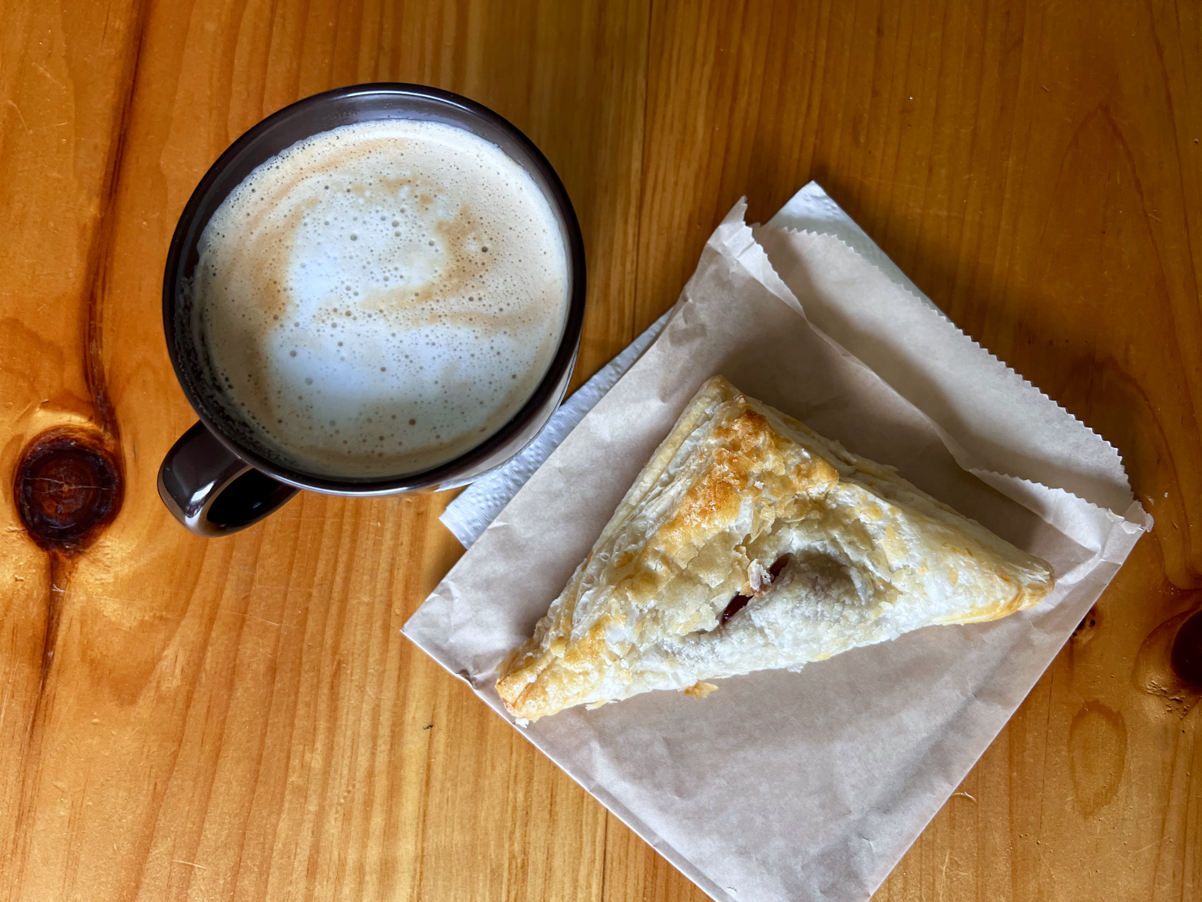 Latte with a guava and cream cheese pastry