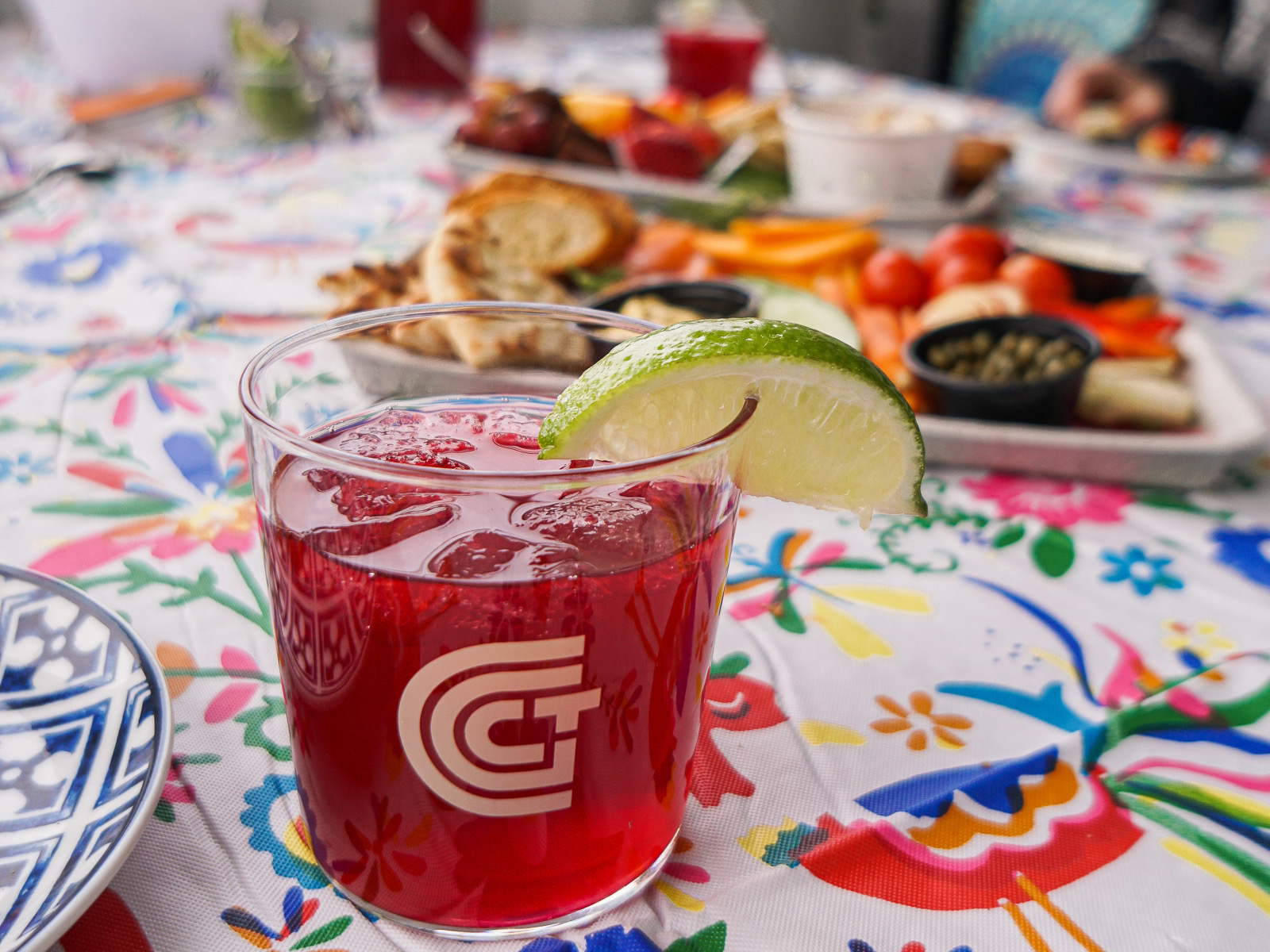 Cocktail in a dining car with food sitting behind it