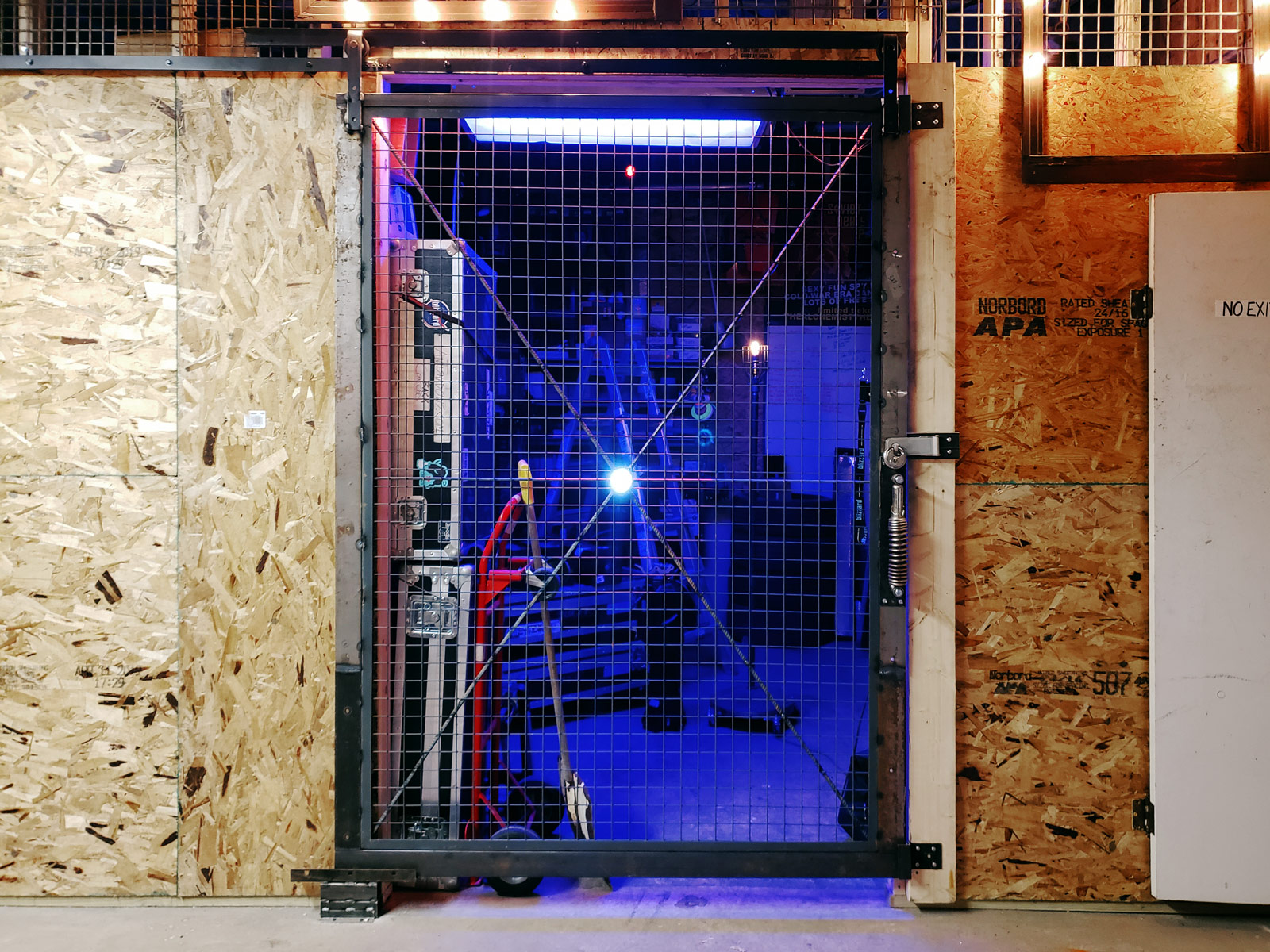 A storage area flooded with blue LED light.