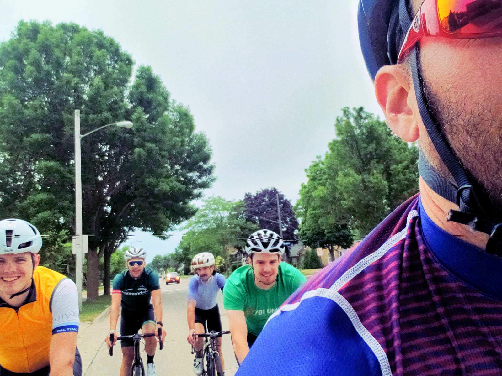 Five guys on a bike ride.