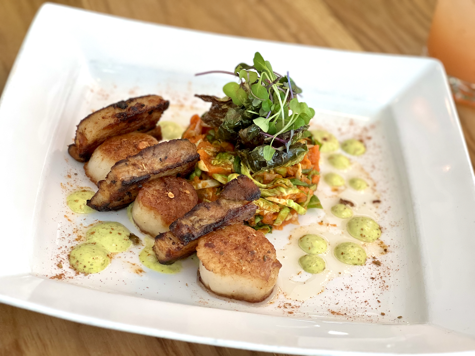 Pork belly and scallops dish at Travieso