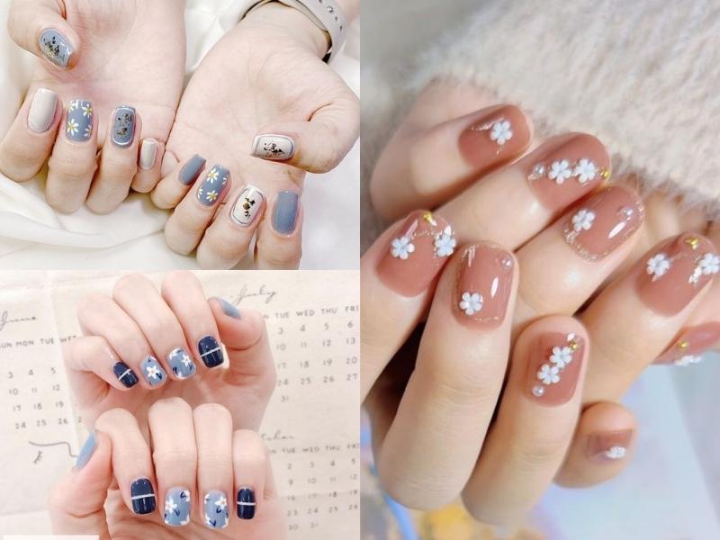 Nail vẽ hoa trắng trên nền hồng, xanh