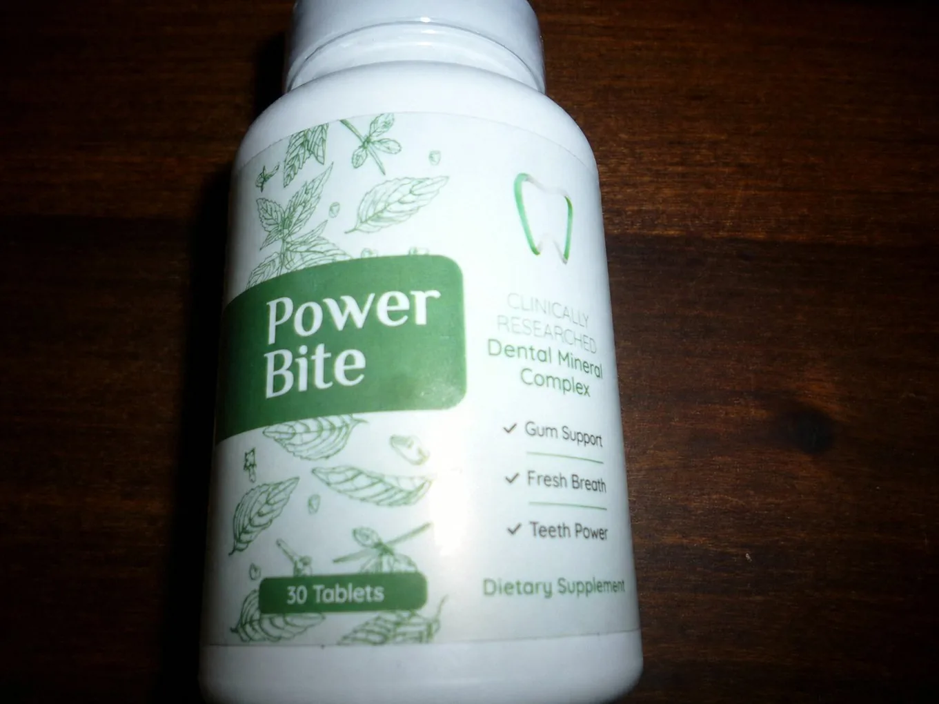 Close view of the PowerBite label: Clinically Researched Dental Mineral Complex, Gum Support, Fresh Breath, Teeth Power