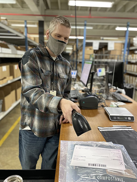 Kitsbow employee using the Ordoro barcode scanning feature