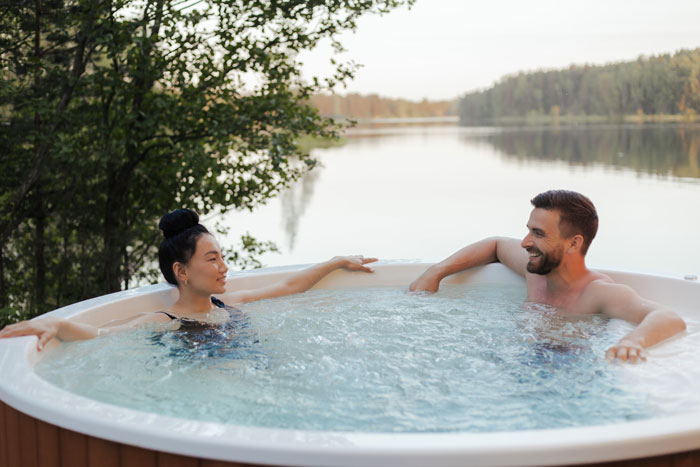 A couple lounging in a jacuzzi