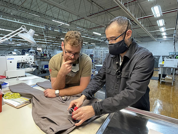 Kitsbow employees examining a shirt