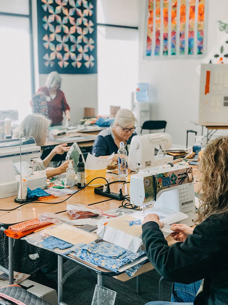 Women making quilts