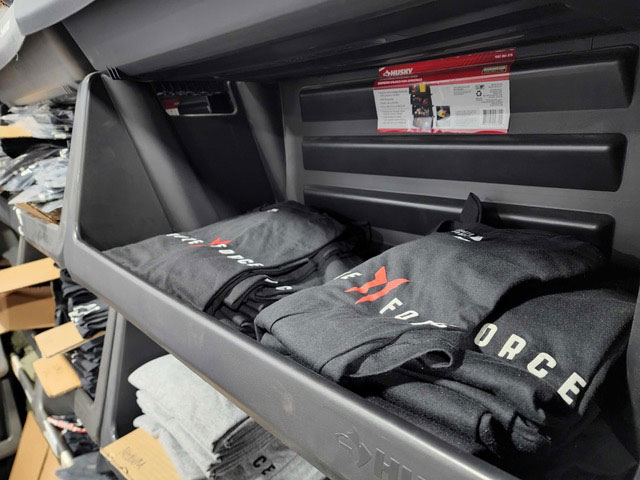 Brute Force shirts in a warehouse bin