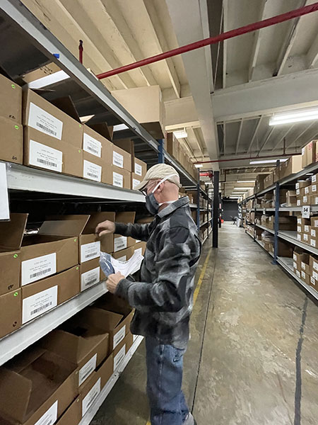 Kitsbow employees using Ordoro pick list to pick some orders