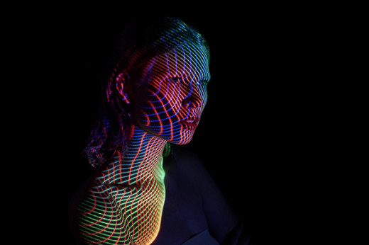 Young Woman Covered by futuristic Lines of Lights