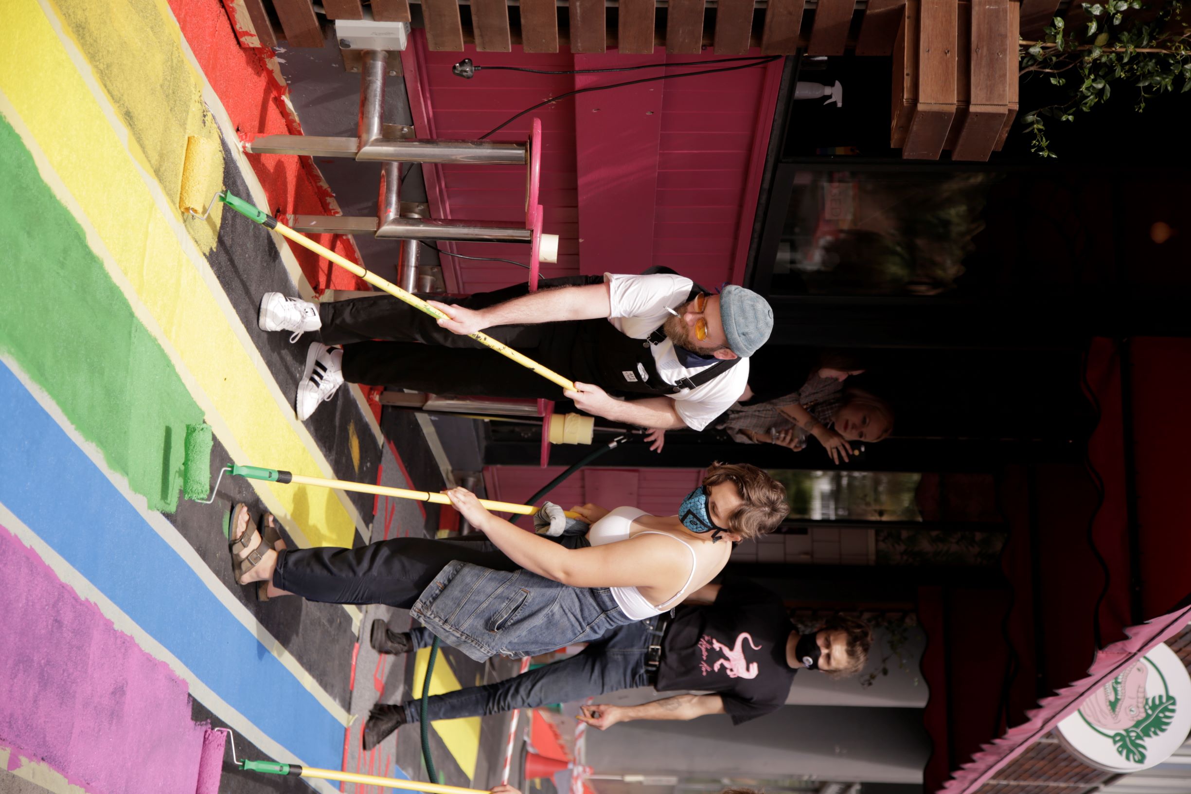 the raptor room pridewalk painting two people painting together