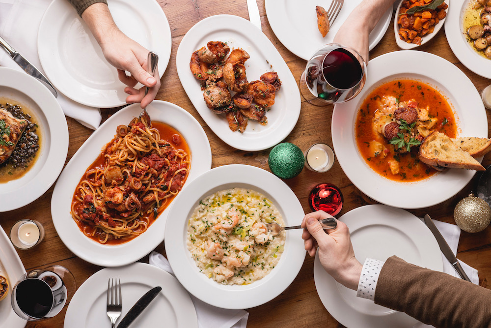 A family-style dinner of pastas, risotto, seafood stew at Osteria Via Stato.
