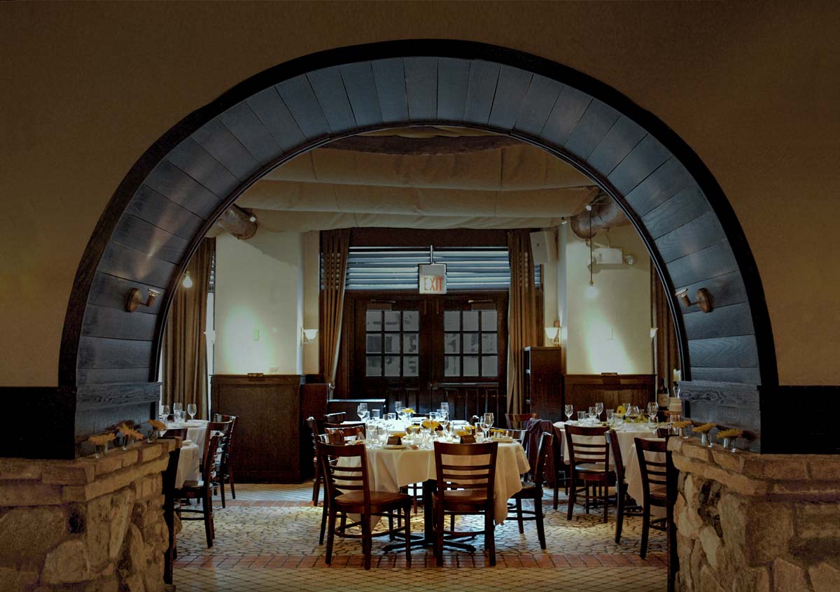 A couple shares a lunch meal with pizza and wine at Osteria Via Stato.