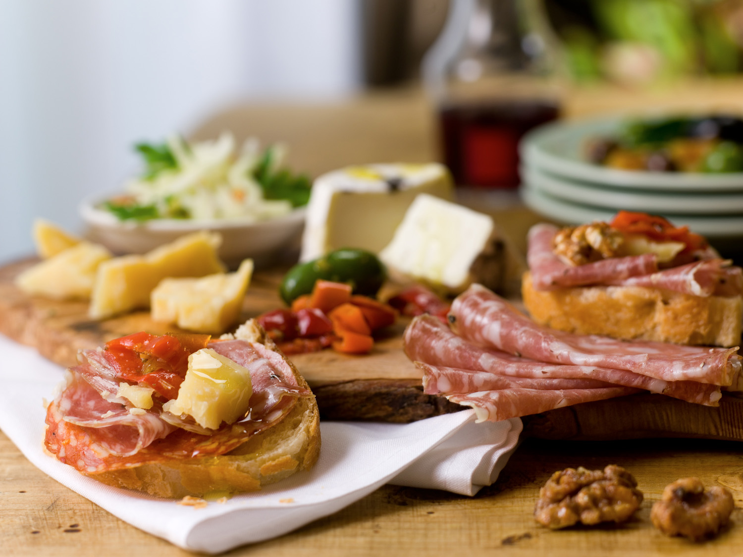 An cheese and charcuterie board at an off-site event, catered by Osteria Via Stato.