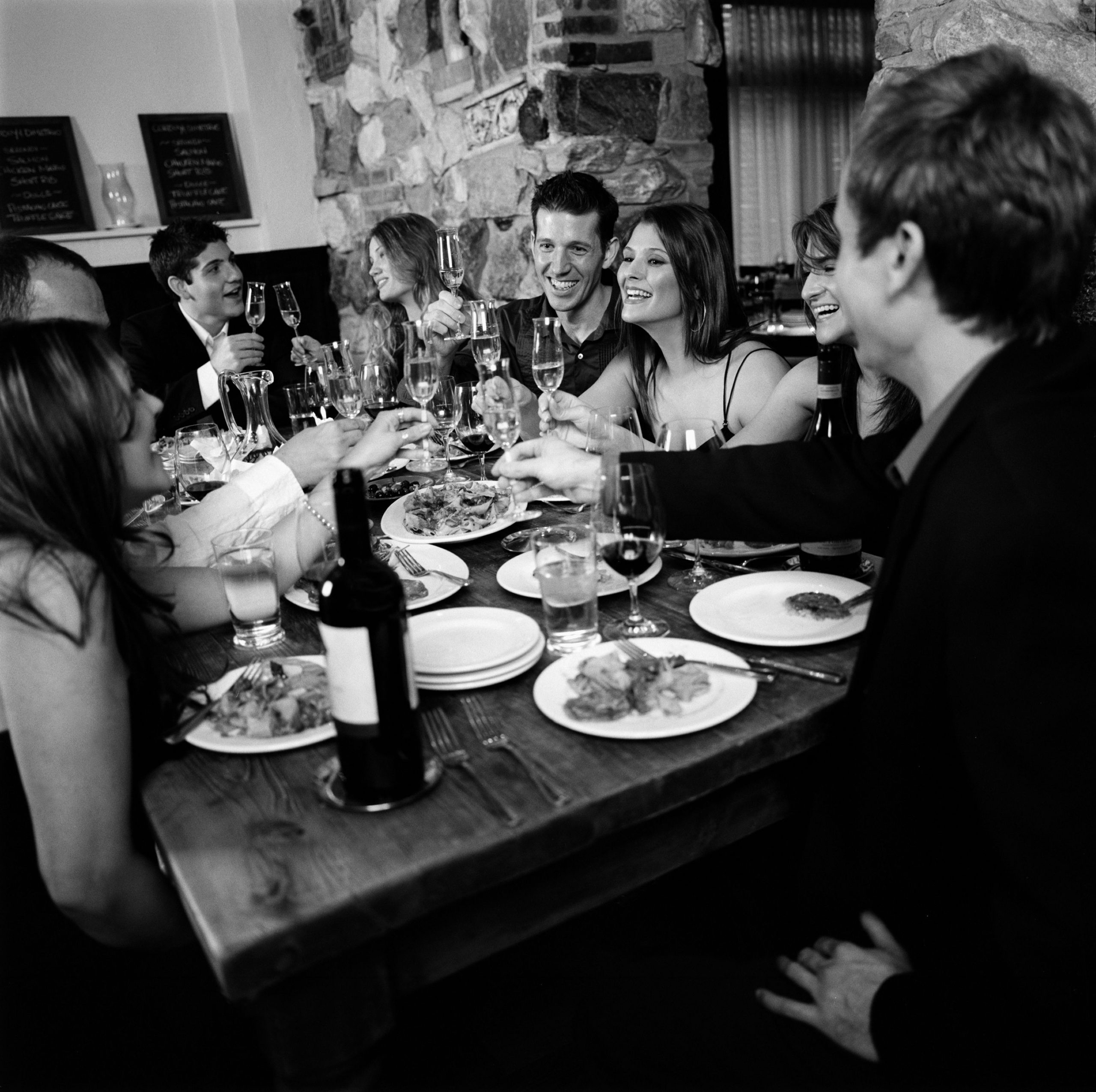 A group of guests hosting a dinner party at Osteria Via Stato.