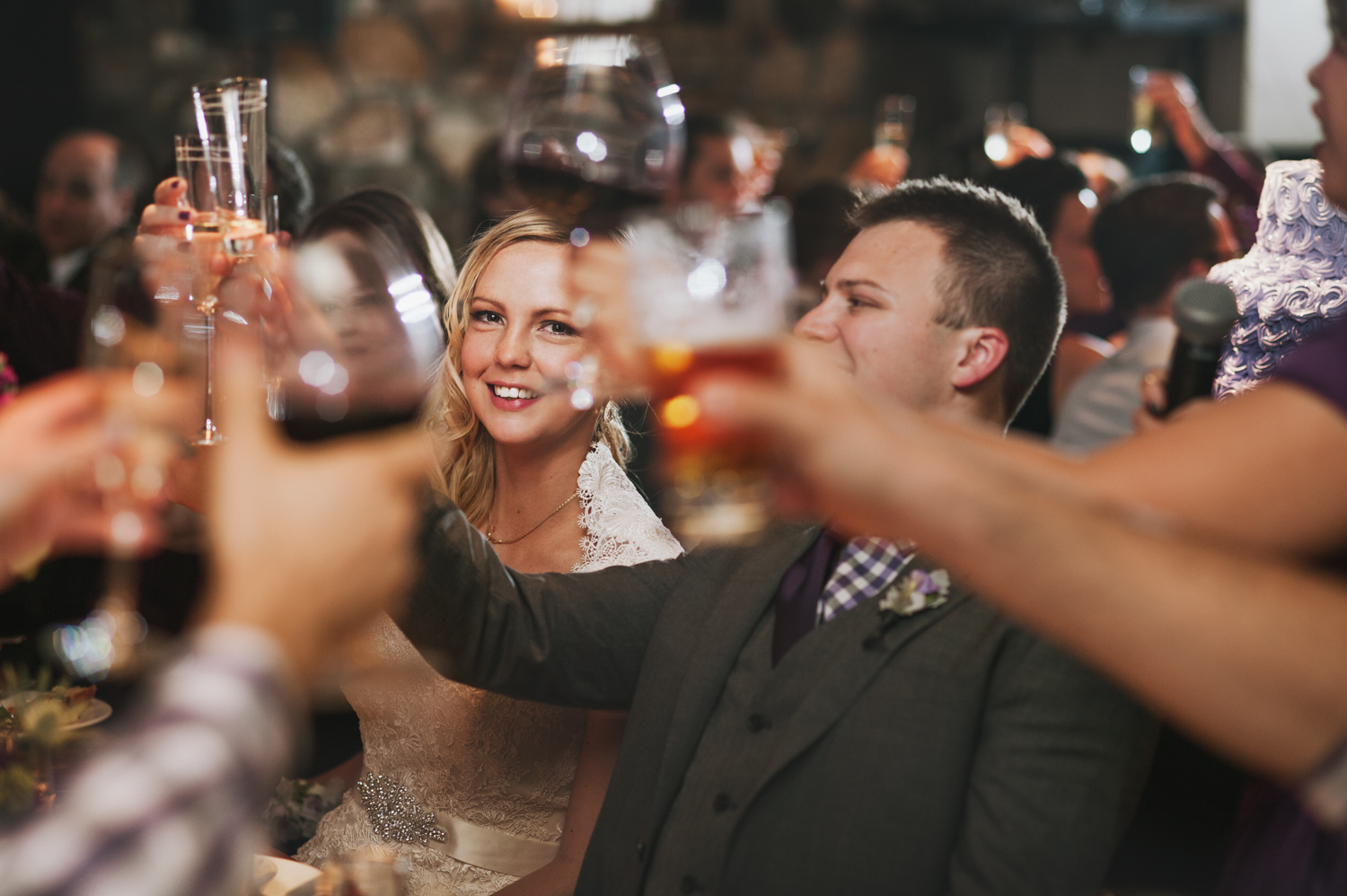 A just married couple shares a toast at their wedding reception at Osteria Via Stato.