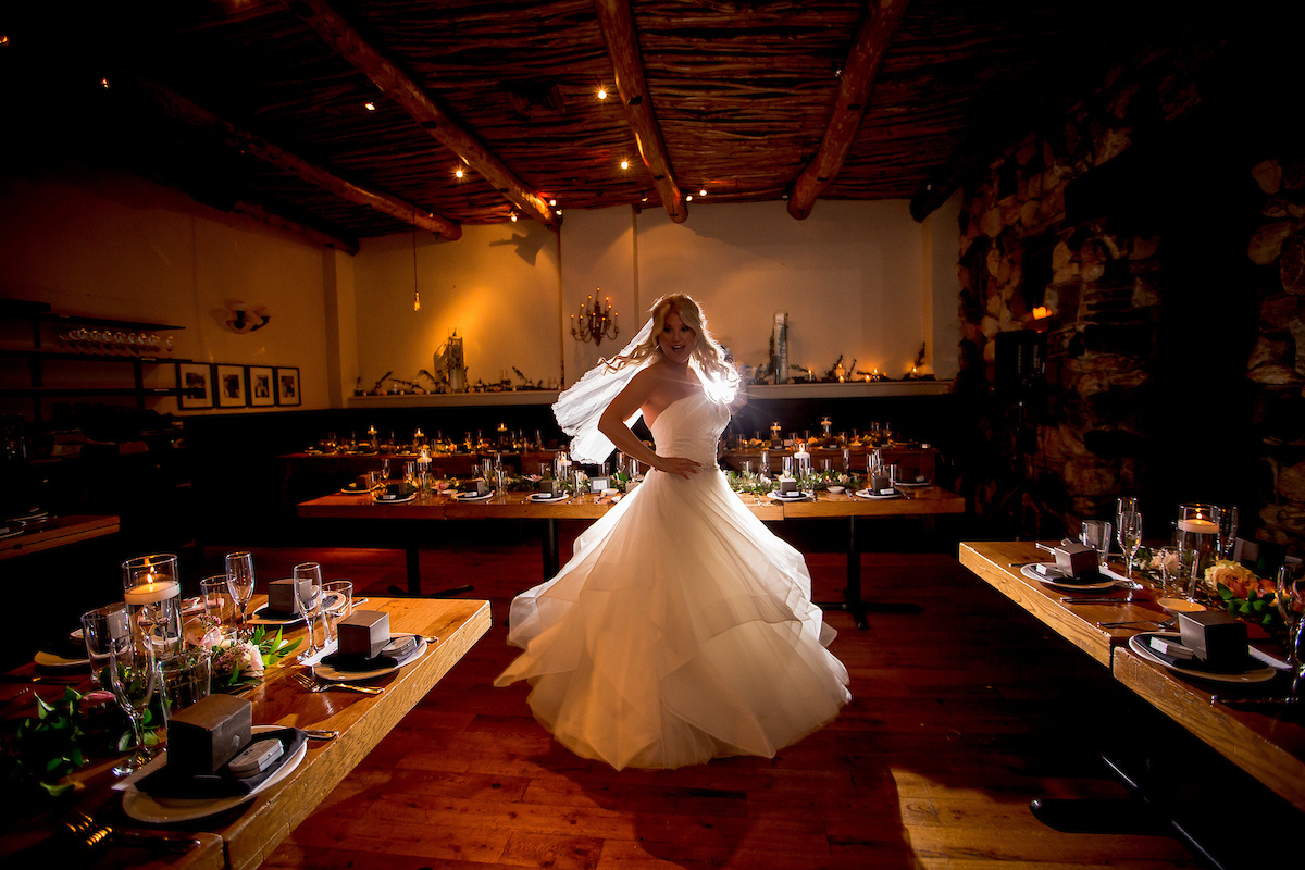 Osteria via Stato bride twirling in dining room.