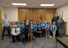 Daisy Troop witnesses official swearing in of McCandless’ K-9, Leroy, while learning about government