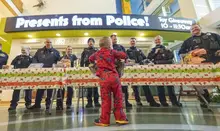Officers bring gifts, holiday cheer during 14th annual Presents From Police