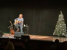 Rick Schuler plays holiday favorites and John Denver classics at the Rocky Mountain High Experience