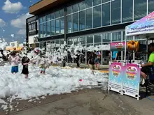 Market's Christmas in July theme channels thoughts of cooler weather with foam 'snow'