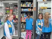 Fairview Elementary Daisy Troop donates books, food in Sharpsburg