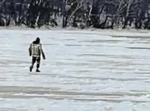 Man who led police on icy river pursuit held for court