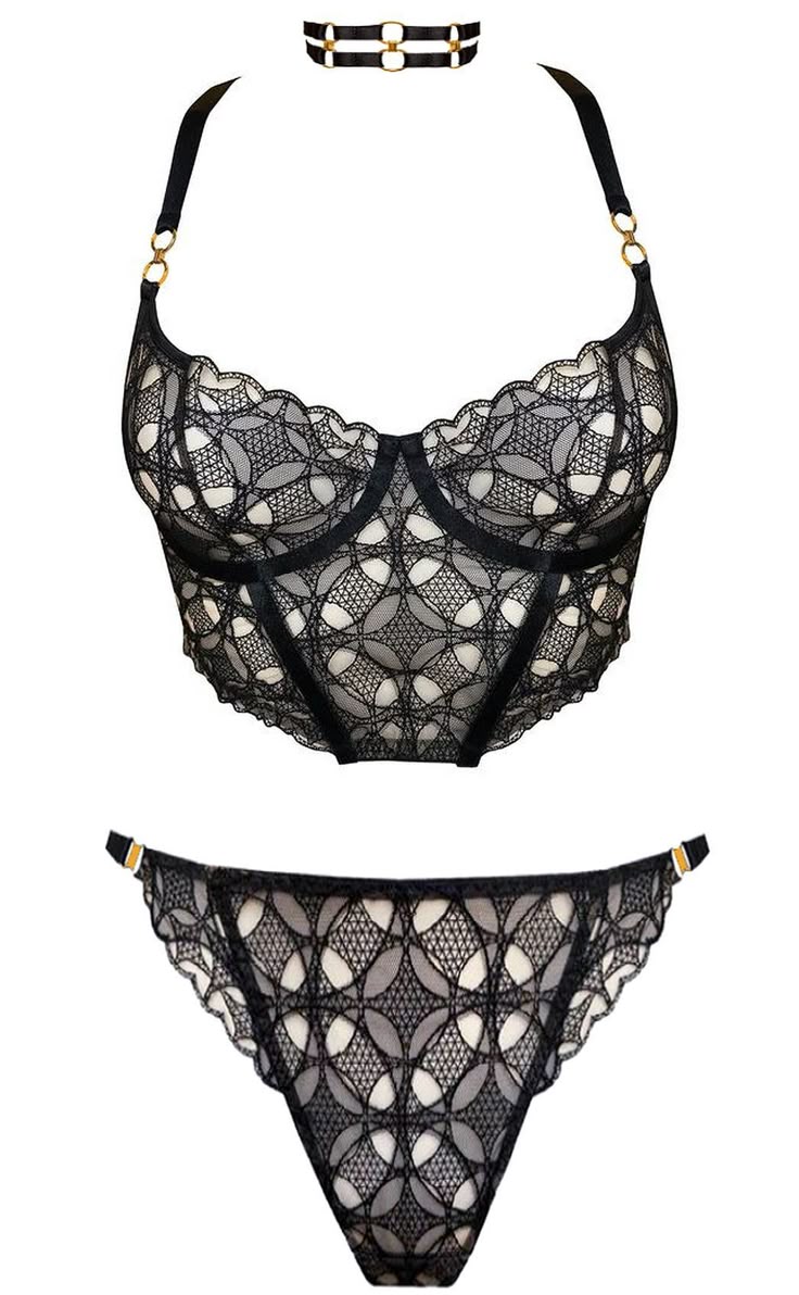 the image shows a lingerie set consisting of a lace halter top, a lace brief and a black choker. the halter top has intricate black lace over a white background, creating a geometric pattern. the top features gold rings where the straps attach. the brief is made of the same lace material, with a similar geometric pattern. it has a small gold ring on the strap. the choker is black with two straps joined by two gold rings. the set is displayed against a white background.