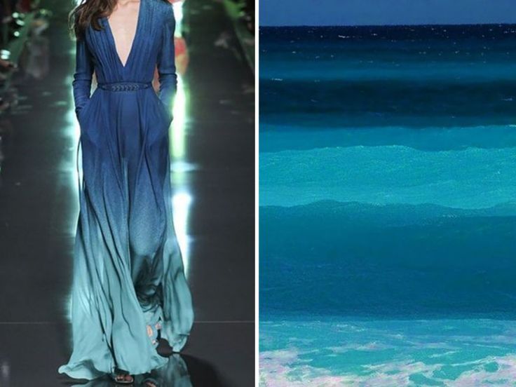 a woman wearing a long blue ombre dress walks down a runway. on the right side of the image is a picture of the ocean with multiple shades of blue.  the dress appears to be inspired by the colors of the ocean.