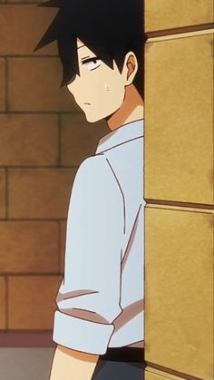 an anime character with short black hair and a white shirt with the sleeves rolled up is shown from the shoulders up, looking to the left. the person is standing next to a wall with a light brown brick pattern.