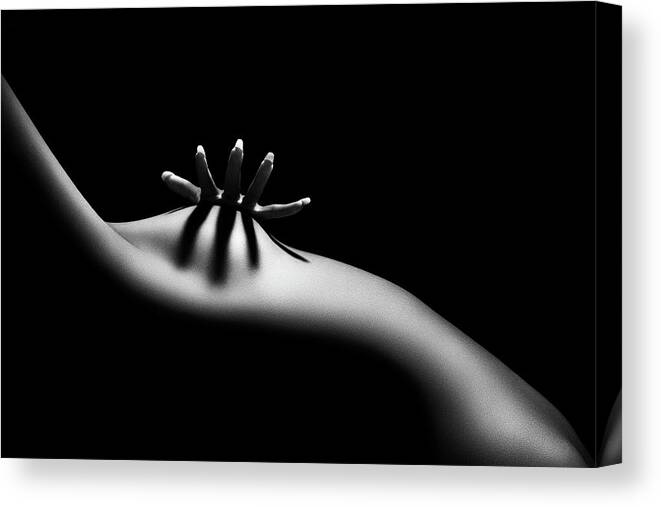 the image is a black and white, closeup photograph of a woman's nude torso.  the woman's body is positioned with a gentle curve, and one hand rests on her lower abdomen. the lighting is dramatic, creating strong shadows and highlights that emphasize the curves of her body and the texture of her skin. the overall effect is sensual and minimalist, focusing on the interplay of light, shadow, and form. the background is entirely black, drawing all attention to the subject's body. the photograph's style is reminiscent of fine art nude photography, conveying a sense of intimacy and vulnerability.