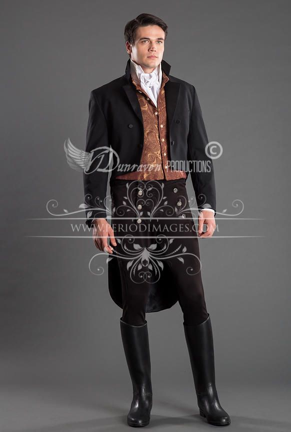 a man wearing a formal black tuxedo, a paisley pattern waistcoat, white dress shirt with a cravat, black leggings and black riding boots.