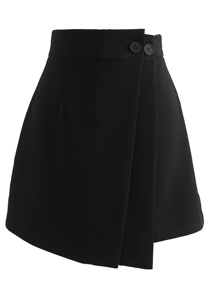 a black mini wrap skirt with a high waist and a button closure at the front. the skirt is styled with a wrap design, creating a flattering silhouette. the fabric is smooth and sleek, giving the skirt a polished look. the skirt is perfect for a variety of occasions, from casual to semiformal. it can be paired with a variety of tops and shoes to create a variety of looks.