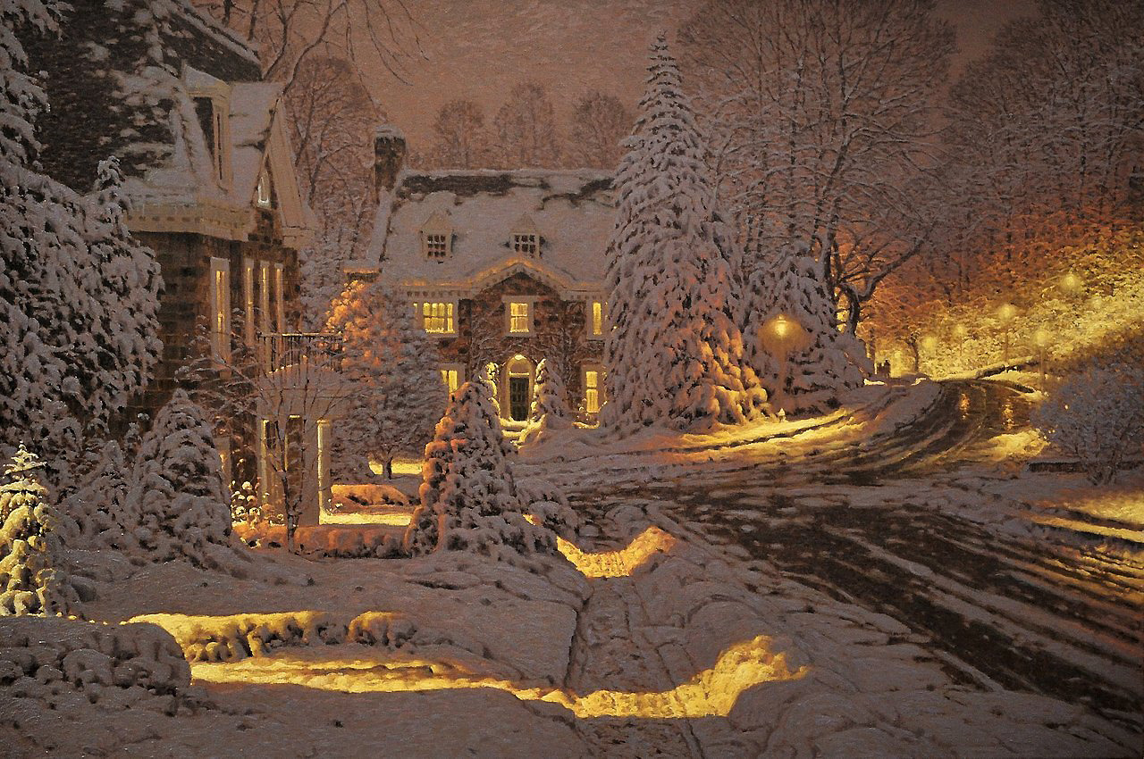 a charming snowcovered street lined with houses is pictured at night. the houses have warm glowing lights emanating from the windows. streetlights illuminate the snow softly.  the scene evokes feelings of warmth and winter cheer.