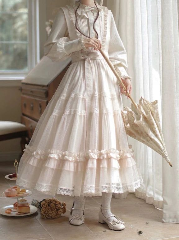 a young woman wearing a long, flowing, white lace dress stands in a room with sunlight streaming through the windows.  she is holding a white parasol with a floral pattern. the dress has multiple layers of ruffles and lace, and she is wearing white shoes with a strap.  the overall aesthetic is romantic, vintage, and feminine.