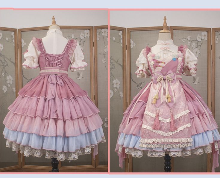 the image shows a pink and blue lolita fashion dress. it is a tiered dress with a lace overlay and a bow in the back. the dress is displayed on a mannequin in front of a wooden screen.