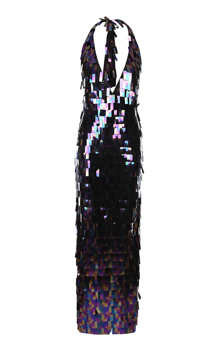 a floorlength black halter dress covered in shimmering sequins. the dress has a sleeveless design and an elegant appearance.