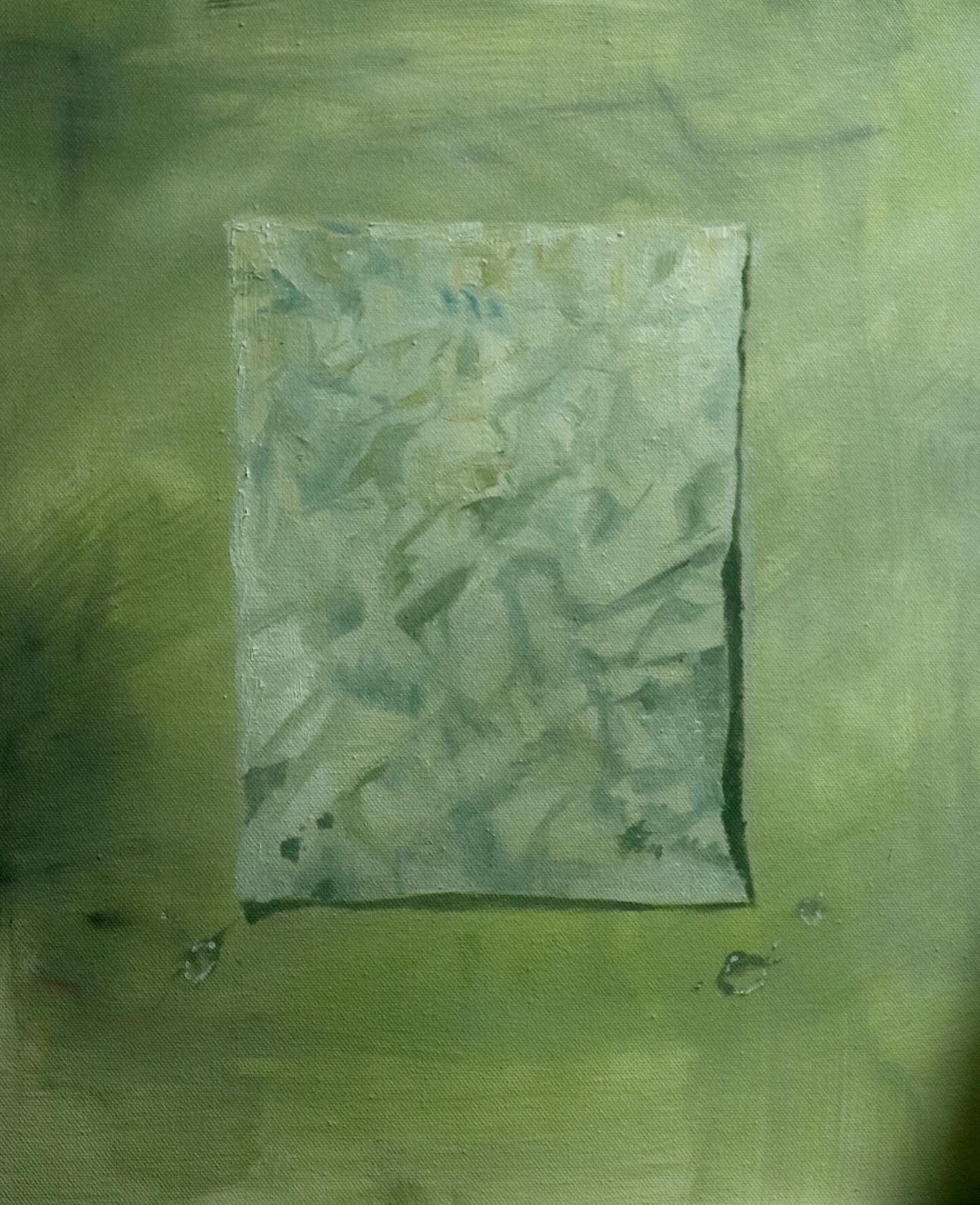 abstract painting with a green background and a lighter green rectangle in the center. the rectangle appears to be a separate piece of canvas that has been attached to the main canvas. there are a few small, dark green dots on the bottom of the painting.