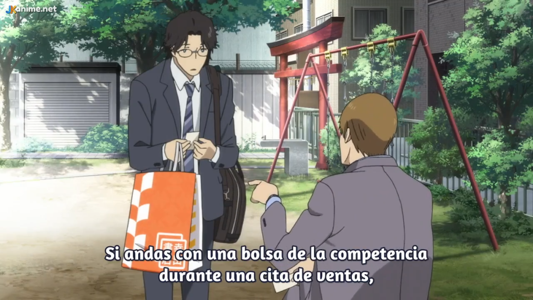 a screenshot from an anime showing two men in suits having a tense conversation in a playground. the man on the right is pointing at a shopping bag held by the man on the left.  the subtitles indicate the conversation revolves around a sales competition and business ethics. the scene is set during the daytime with bright natural lighting, showcasing a playground with a swingset and a traditional japanese torii gate in the background.