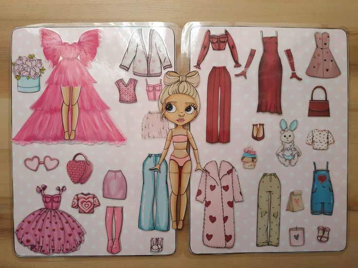 the image shows a set of vintagestyle paper doll cutouts on two cardboard sheets. there is a central doll figure and a variety of clothes and accessories, including dresses, tops, pants, outerwear, shoes, bags, and other items, all designed in a cartoon, kawaiilike style with a predominant pink color scheme and many with a heart pattern. the set seems designed for play and fashion exploration for a doll.