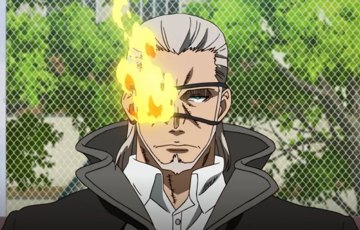 the image is a closeup of an anime character from a manga. he has white hair and a serious expression on his face. he is wearing a black coat and a grey shirt. he has an eyepatch over his right eye, and the patch is on fire.