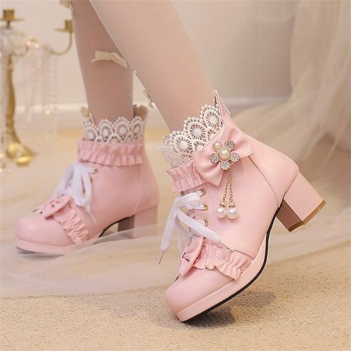 the image showcases a pair of charming pink laceup boots designed for women, featuring an appealing lolita fashion aesthetic. the boots are adorned with intricate lace detailing, delicate bows, and shimmering pearl embellishments, adding a touch of elegance and femininity. they are set against a soft, lightcolored background, further enhancing their delicate and dreamy appeal. the lighting is bright, highlighting the intricate details and vibrant pink hue of the footwear. the perspective is from a slightly low angle, drawing attention to the unique design and overall cuteness of these stylish boots.