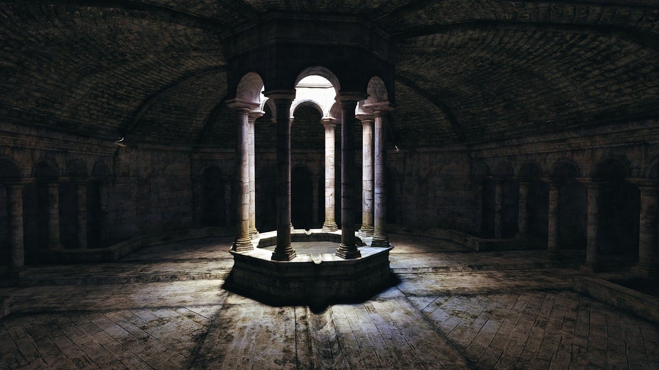 this image depicts the interior of a stone building, possibly an ancient chamber or dungeon. the space is dimly lit, with a central octagonal structure featuring columns and arches. light streams in from openings above, casting shadows across the stone floor. the surrounding walls are lined with arches and columns, adding to the sense of history and depth. the overall atmosphere is dark and symmetrical, suggesting a historical or architectural significance.