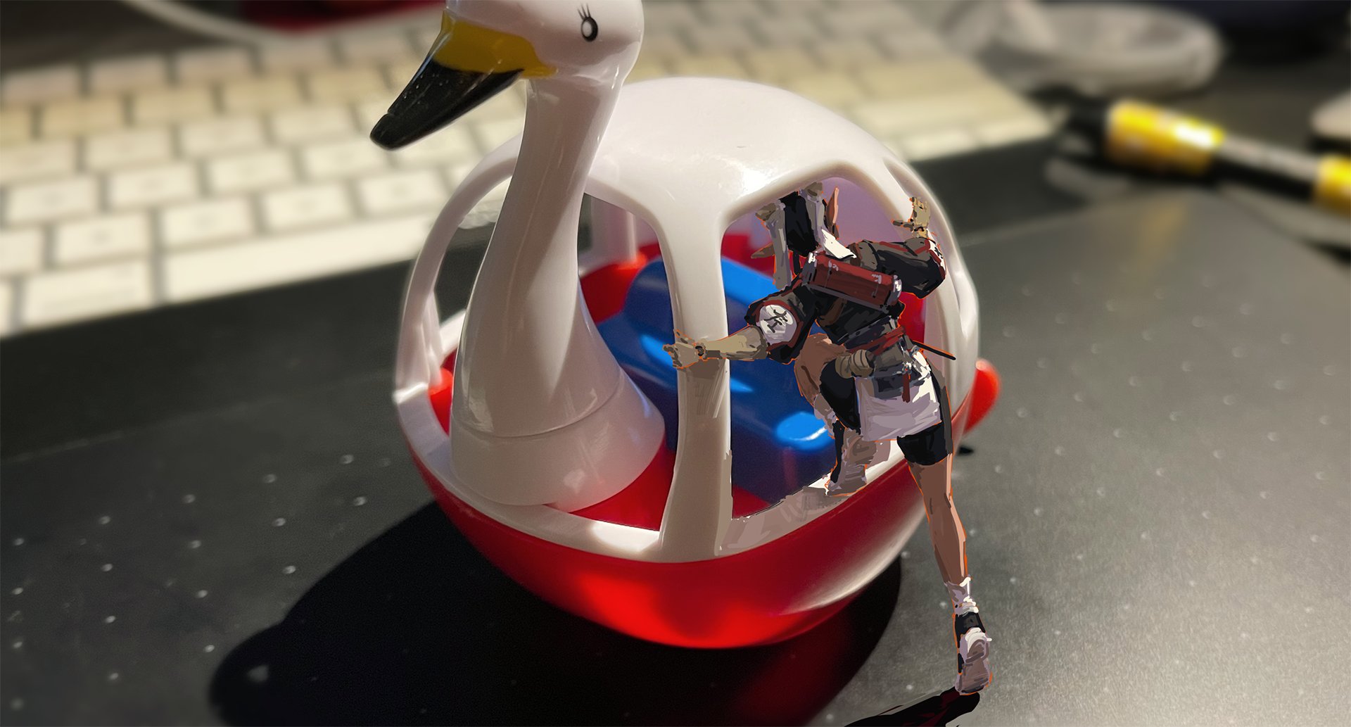 the image shows a small plastic toy swan boat, predominantly red and white. a miniature animestyle female character, appearing to be from a video game or similar, is superimposed onto the image as if she's inside the boat, seemingly trying to get out.  the boat sits on a darkcolored desk, with a blurredout computer keyboard visible in the background along with a pen or stylus. the overall impression is a fun, slightly surreal composition created through image manipulation, perhaps for a social media post or similar application.
