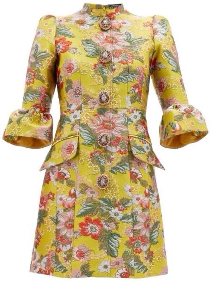 a bright yellow mini dress with a floral pattern. the dress has a high neck with decorative buttons down the front, fitted bodice with small flared sleeves, and a short length.