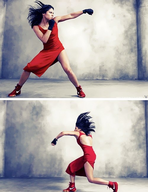 he image features a woman in a red dress executing boxing moves within a studio setting. she is captured in two dynamic poses, showcasing athleticism and strength. the studio environment features a neutral grey backdrop, while dramatic artificial lighting accentuates her form and the movement of her hair.  the overall aesthetic is one of power and grace, blending athleticism with feminine attire.