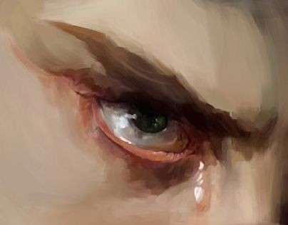 close up of an eye with a tear rolling down from it. the eyebrow is furrowed, suggesting sadness.