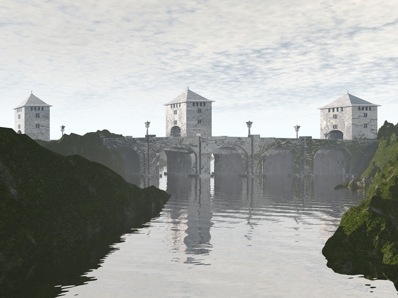 a picturesque view of a stone bridge with towers spanning a river. the bridge is constructed with multiple arches and topped with three square towers. the river reflects the bridge and towers, creating a mirror effect. the landscape is rocky and green with a cloudy sky overhead. there is fog around the bottom of the arches.