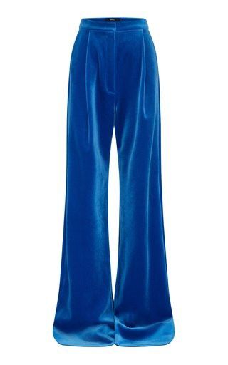 a pair of wideleg pants in a vibrant blue velvet fabric. the pants have a high waist and a relaxed fit, with pleats down the front. they are a contemporary and chic style that can be dressed up or down.